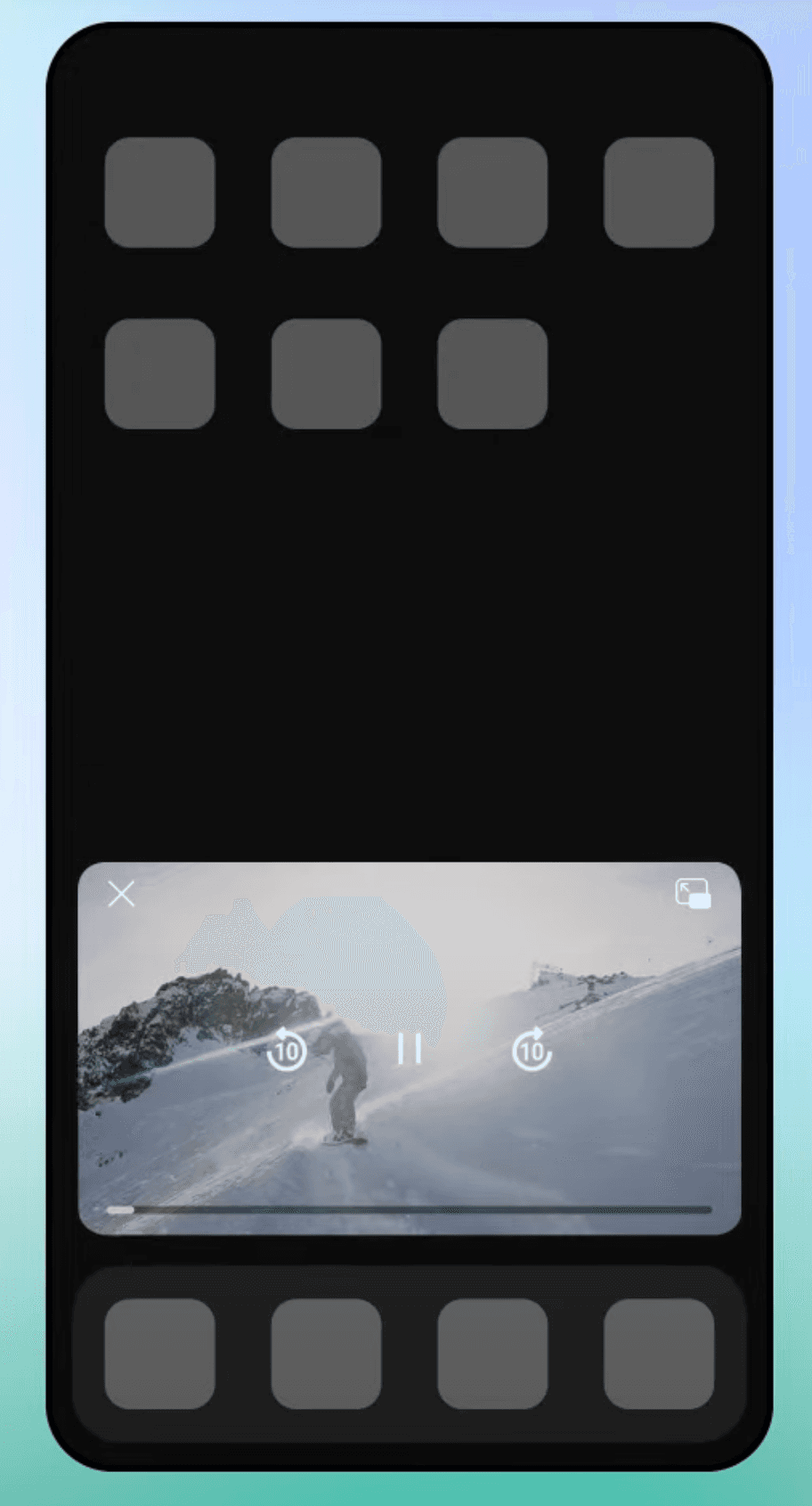Image represents a mobile phone screen displaying a video player interface. The screen is predominantly black, with a rectangular video player occupying the central portion.  The video shows a snowboarder on a snowy mountain slope.  The video player includes a close button (an 'X' in the top left corner), a full-screen button (a square with an arrow pointing out in the top right corner), a play/pause button (||) centered below the video, and two circular buttons with a '10' inside, positioned on either side of the play/pause button, likely representing a 10-second skip forward or backward functionality. A thin horizontal progress bar is visible below the video. Above and below the video player are rows of six gray, square placeholders, likely representing icons for additional features or controls, though their specific functions are not indicated. The overall arrangement is vertically oriented, with the video player sandwiched between two rows of these placeholder icons.  The phone screen itself is bordered by a slightly lighter, almost teal, background.